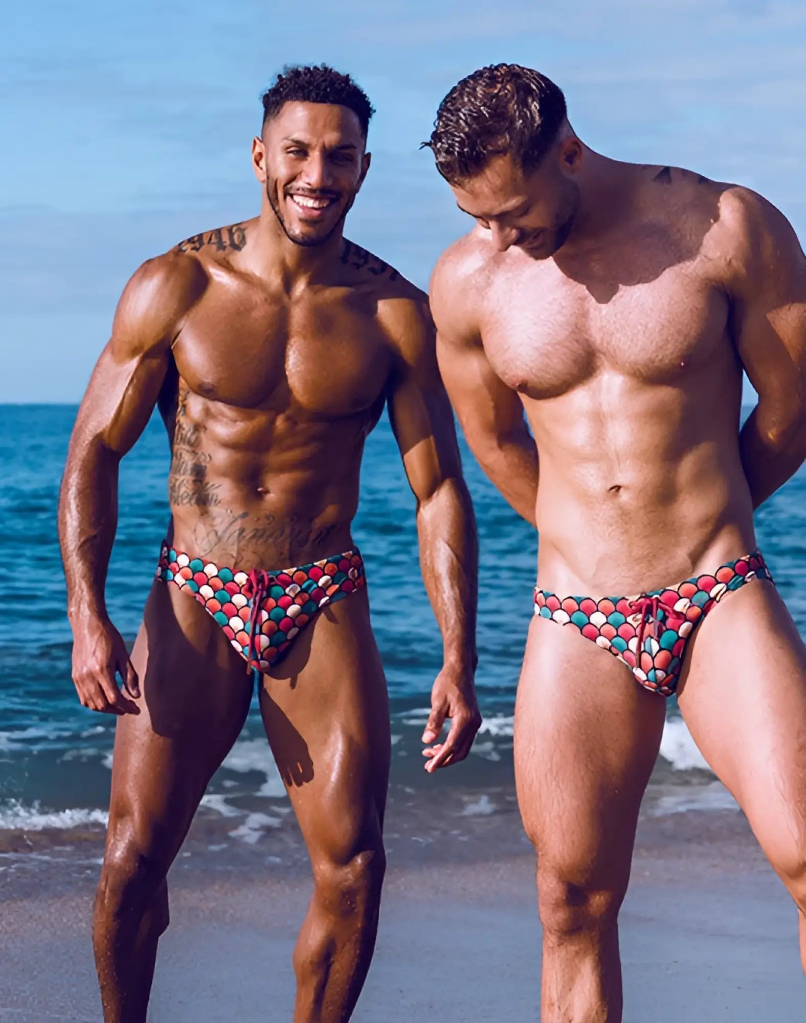 Men’s 2EROS V10 print swim brief with vibrant red blue and white circular pattern ideal for swimming and beachwear