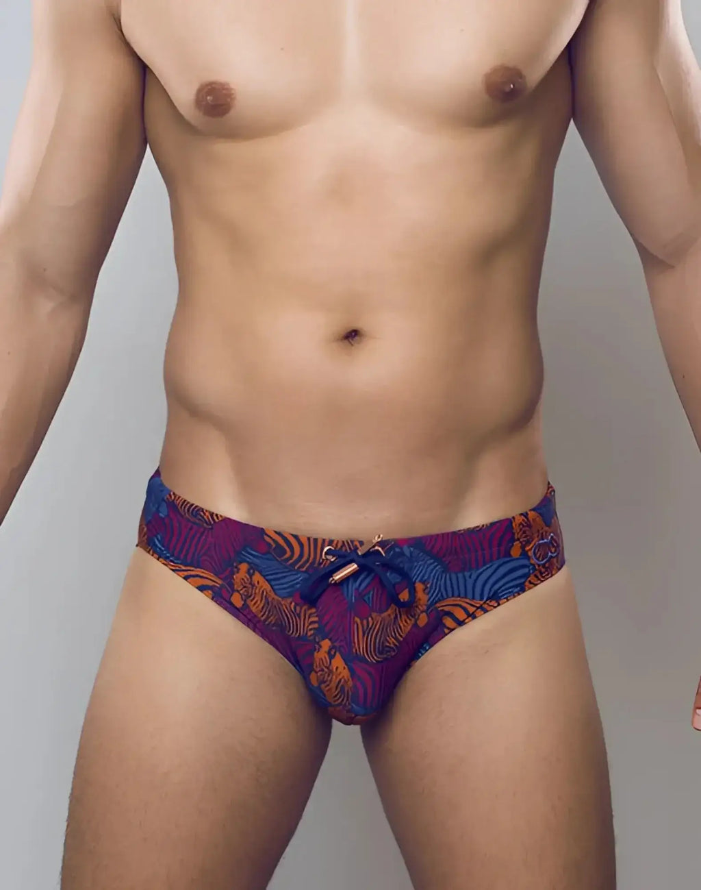 2eros v10 print swim brief stallion navy featuring vibrant purple and orange tiger-patterned fabric with blue drawstring tie