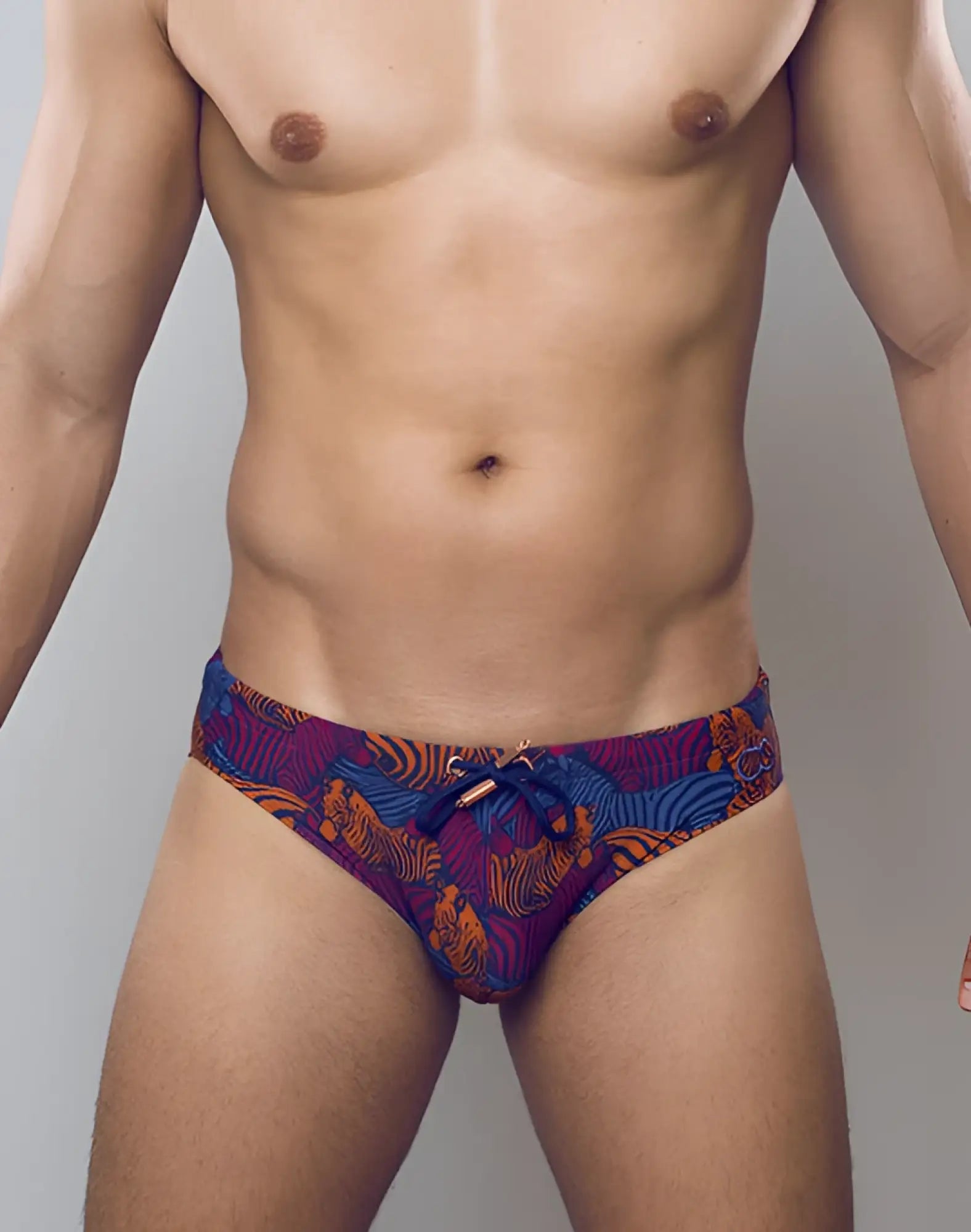 2eros v10 print swim brief stallion navy featuring vibrant purple and orange tiger-patterned fabric with blue drawstring tie