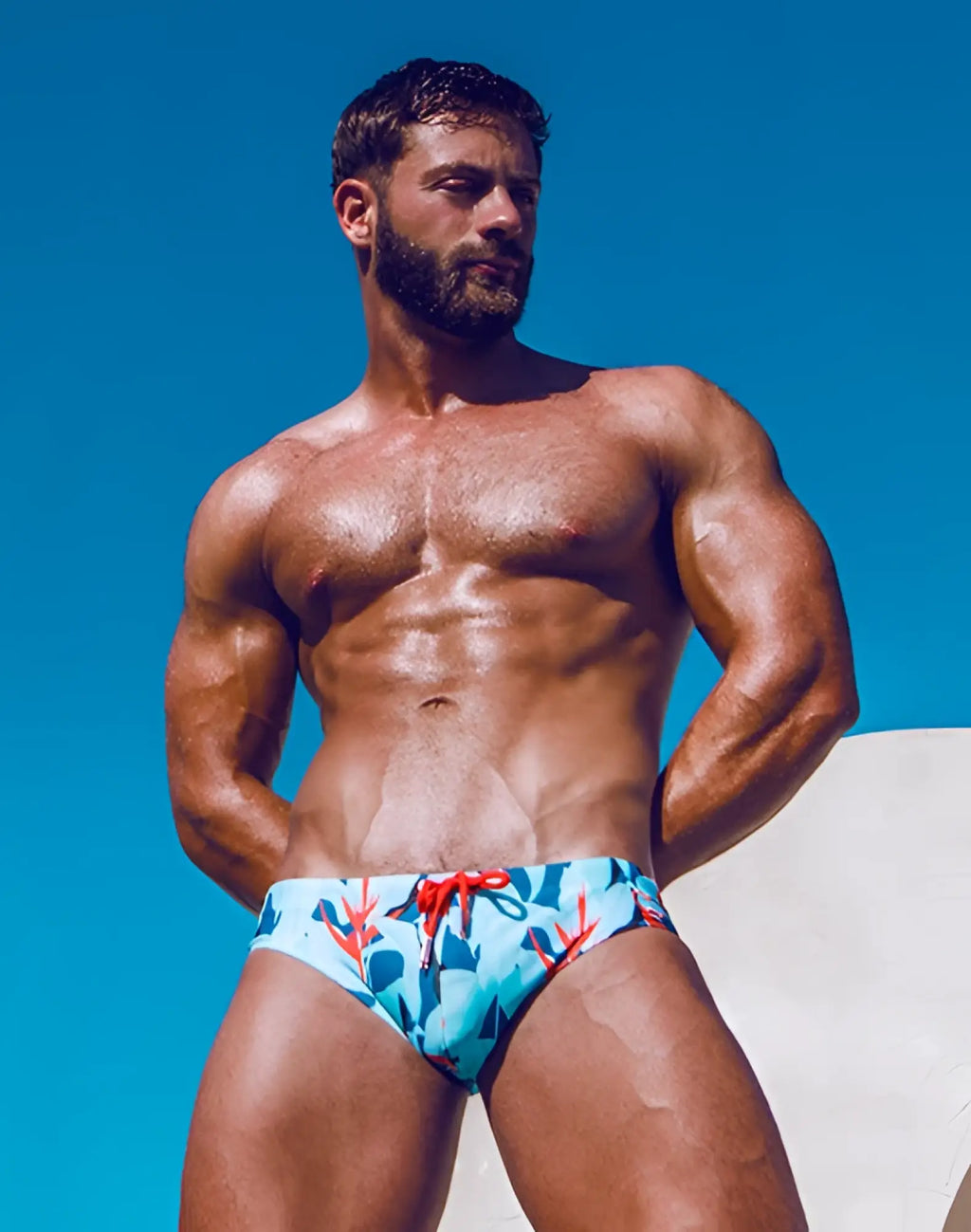 2eros v10 print swim trunks with blue and red tropical leaf pattern and bright red drawstring for beachwear