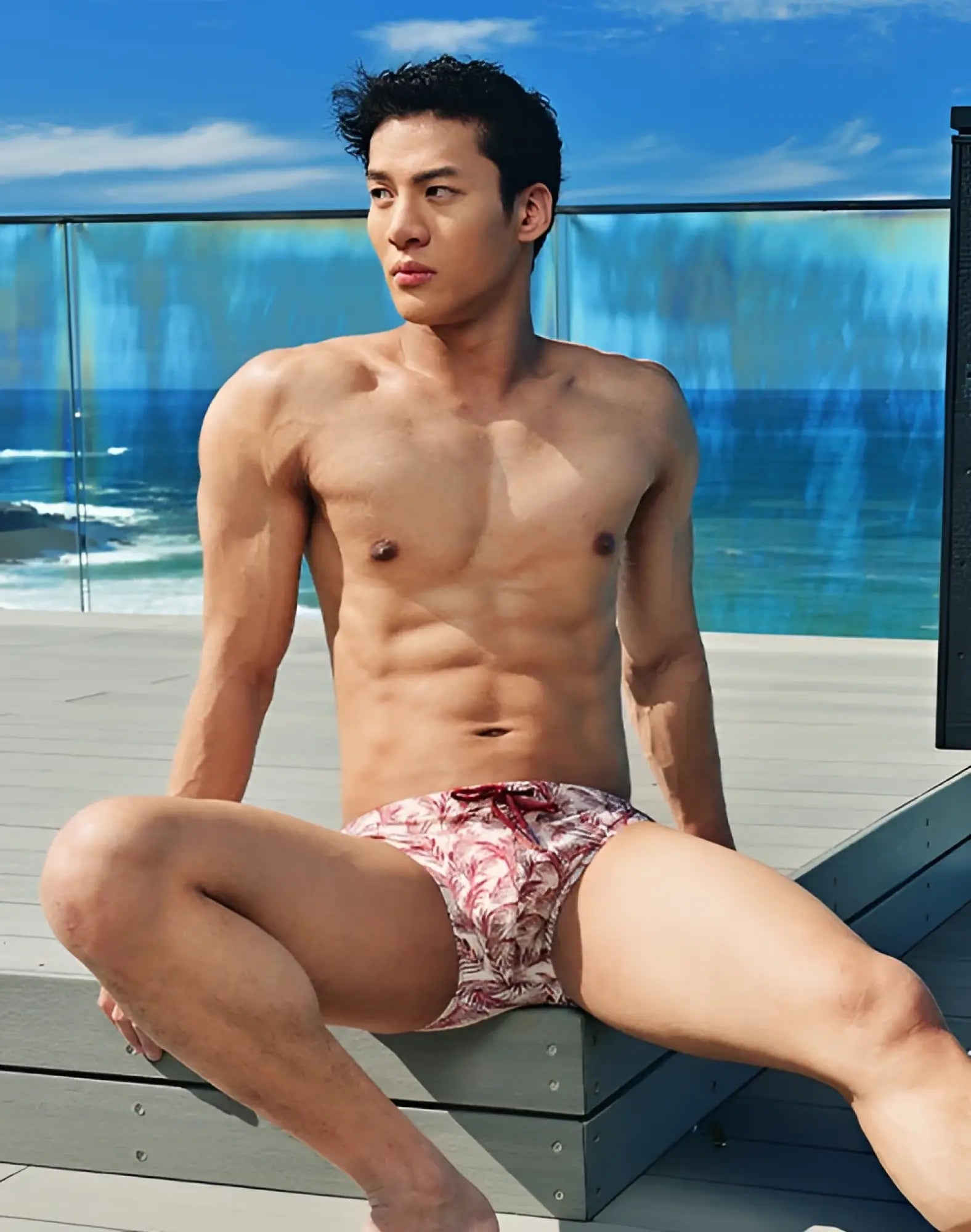 Red and white patterned 2EROS V10 print swim trunks with tropical leaf design for pastel Hawaii summer wear