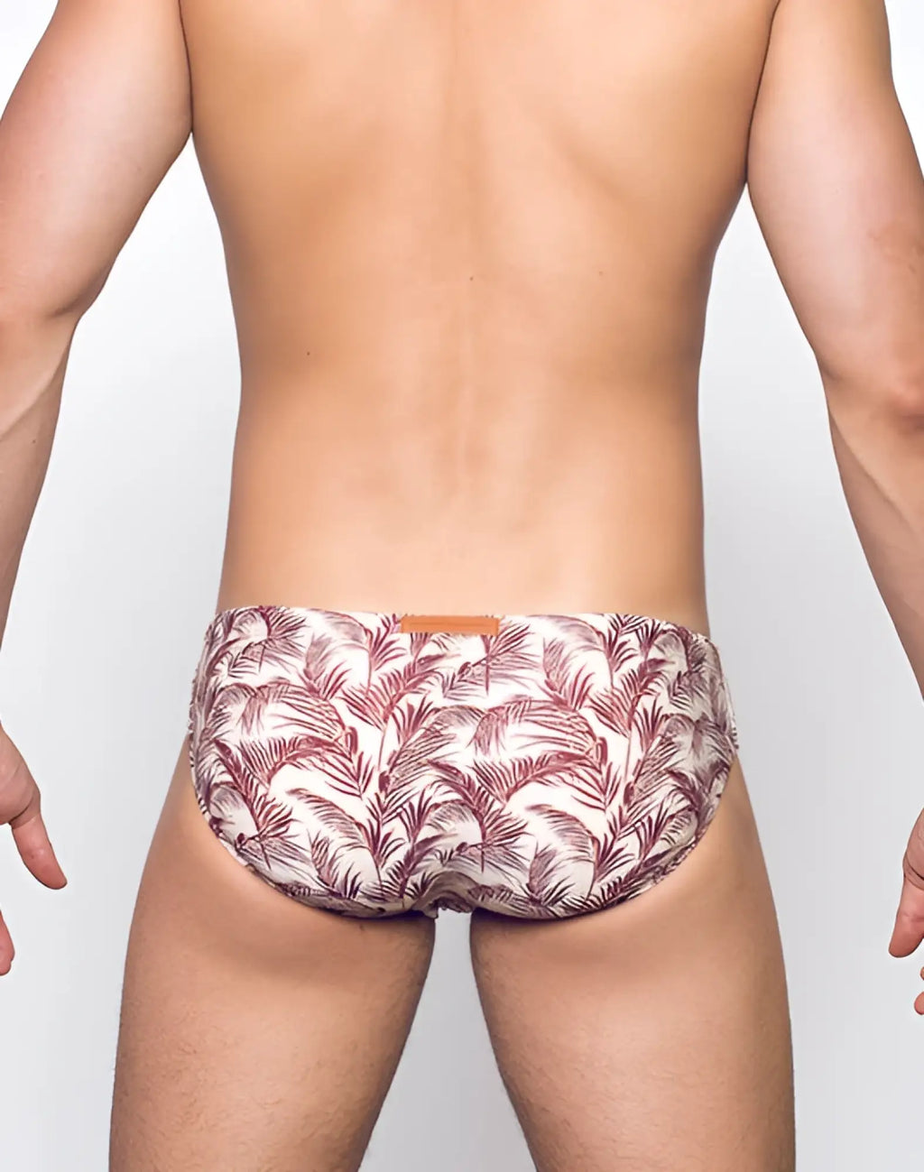 White briefs with maroon tropical leaf print and leather tag on waistband from 2eros v10 print swim pastel hawaii collection