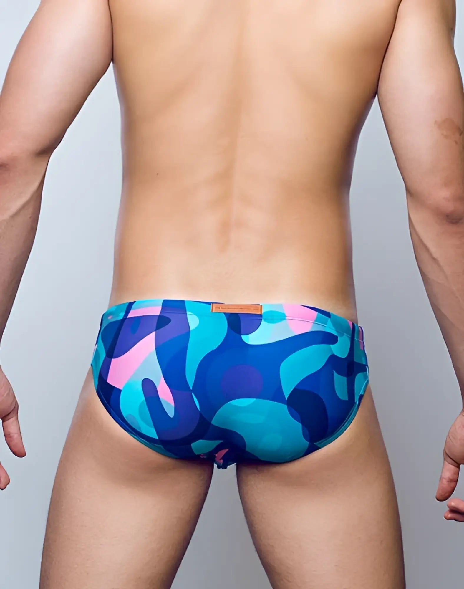 Vibrant blue and pink abstract camouflage 2eros v10 print swim trunks designed for comfortable swimwear use