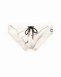 White 2EROS V10 print swim trunks with black abstract line art colorful speckles and black drawstring bow at front