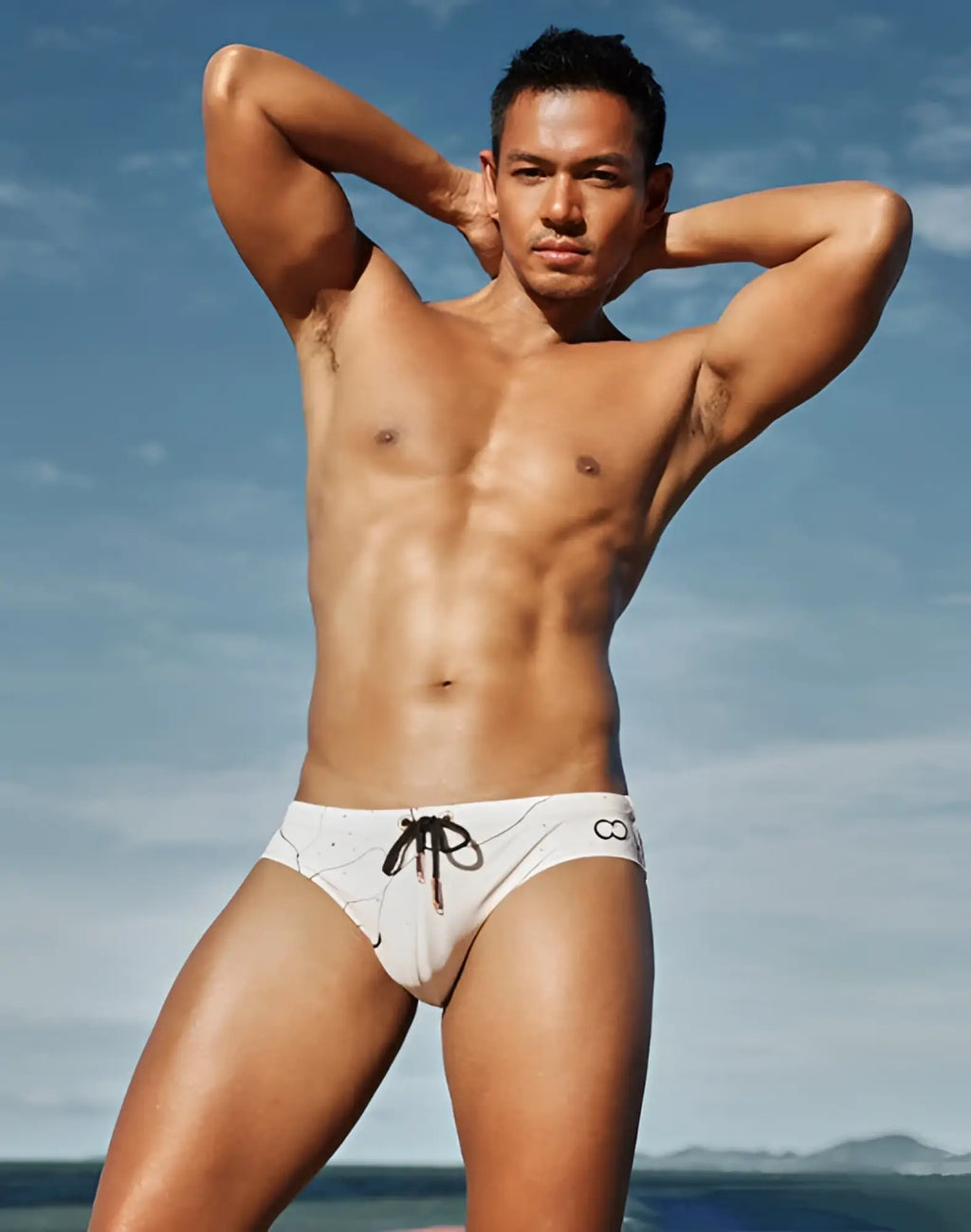 White 2eros v10 print swim trunks with black drawstring and subtle marble pattern featuring side logo