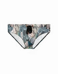 A pair of 2EROS V10 print swim trunks with bold teal gray and white abstract pattern and black drawstrings