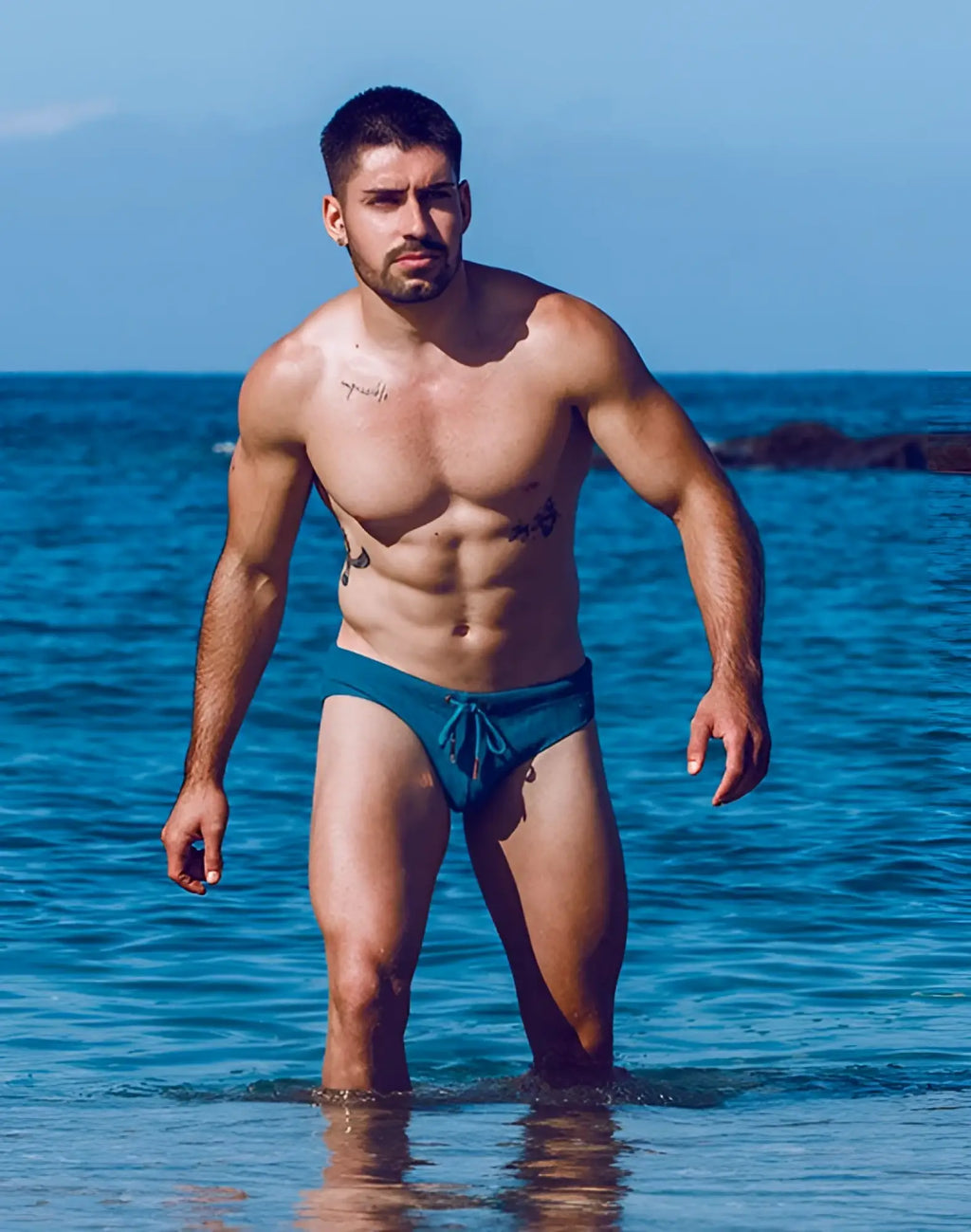 Teal blue 2EROS V10 swim brief with drawstring waistband designed for comfortable swimming and water activities