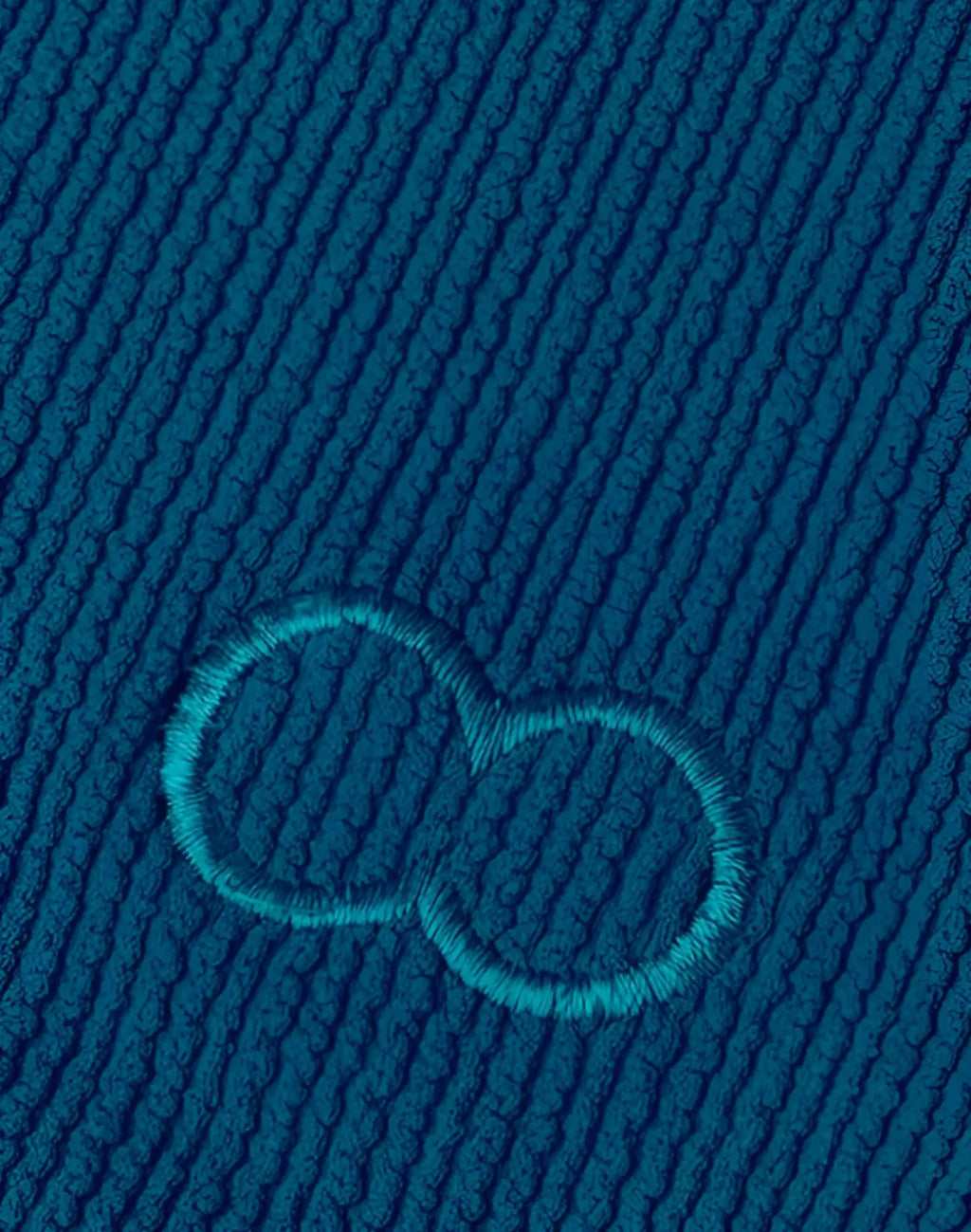 Deep teal ribbed 2EROS V10 swim brief featuring subtle embroidered infinity symbol in matching thread