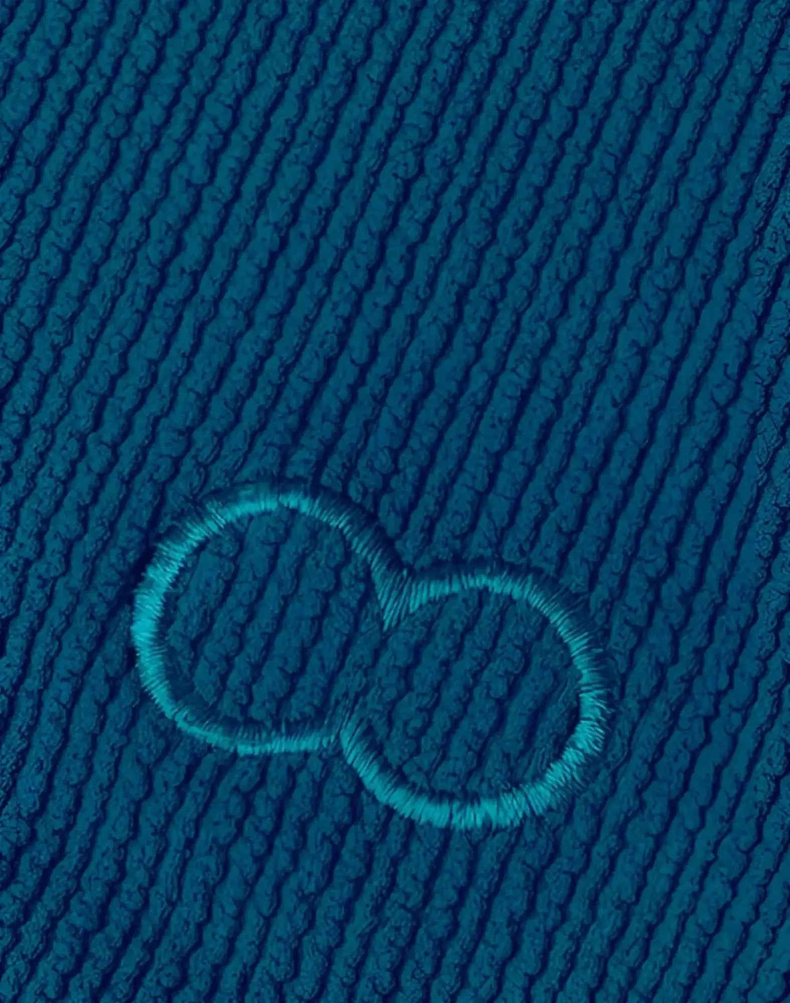 Deep teal ribbed 2EROS V10 swim brief featuring subtle embroidered infinity symbol in matching thread