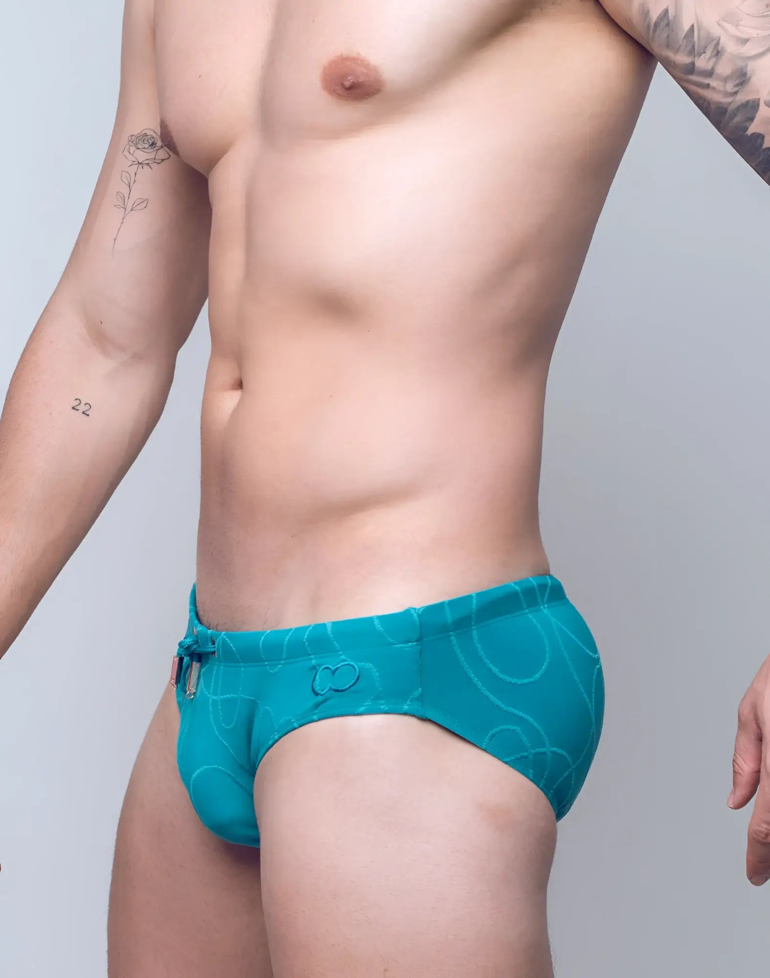 2eros v10 textured swim brief in ripple green with a subtle abstract pattern and small front logo