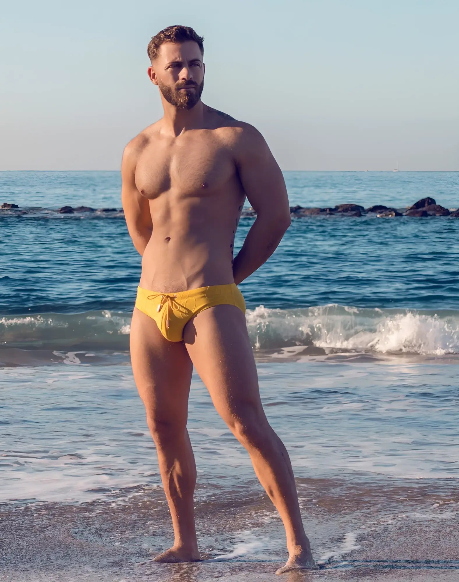 Bright yellow 2EROS V10 textured swim brief with ripple pattern and drawstring waistband for swimming use