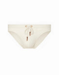 Cream-colored 2EROS V20 Core swim trunks with drawstring closure and rose gold metal accents in sand color