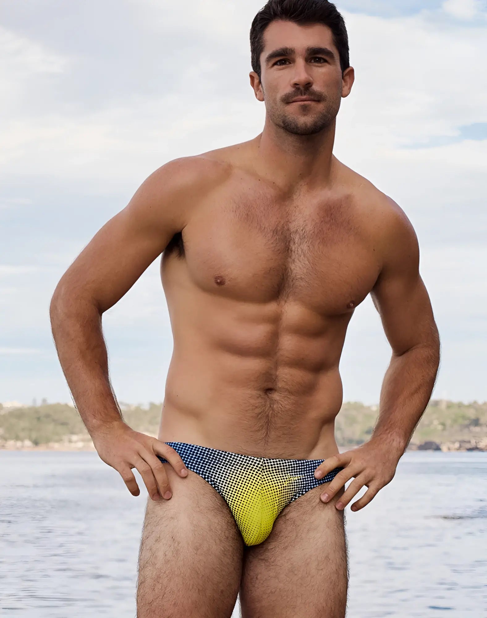 2EROS V20 printed swim brief in blue and yellow gradient with checkered pattern for stylish swimwear use
