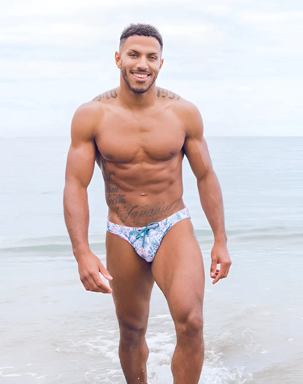2eros v20 printed swim brief in coral teal with blue and white patterned lace-up front swim trunks design