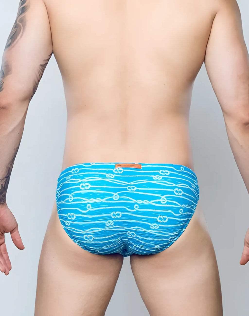 2eros v20 printed swim brief in manrope blue featuring white wave and flower patterns for men