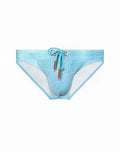 Light blue textured 2EROS V20 swim trunks with matching drawstring and metallic accents in nautica green color
