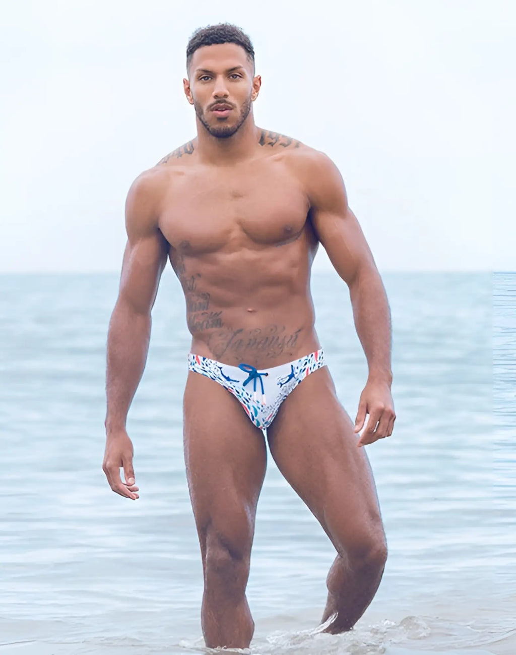 White 2EROS V20 printed swim brief with blue floral pattern and matching blue bow at the front for swimming