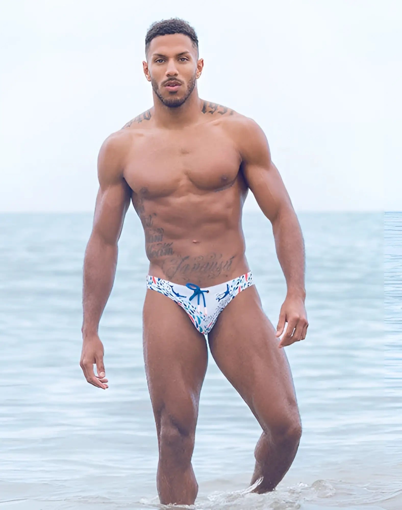 White 2EROS V20 printed swim brief with blue floral pattern and matching blue bow at the front for swimming