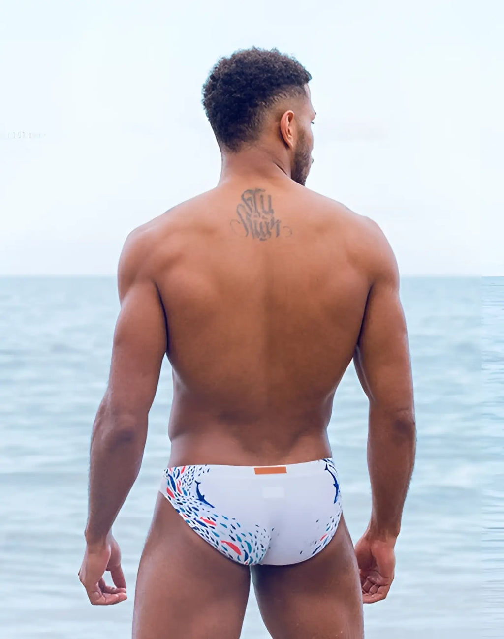 White swim trunks with colorful blue red and green peacock feather pattern from 2EROS V20 printed swim brief seascape white