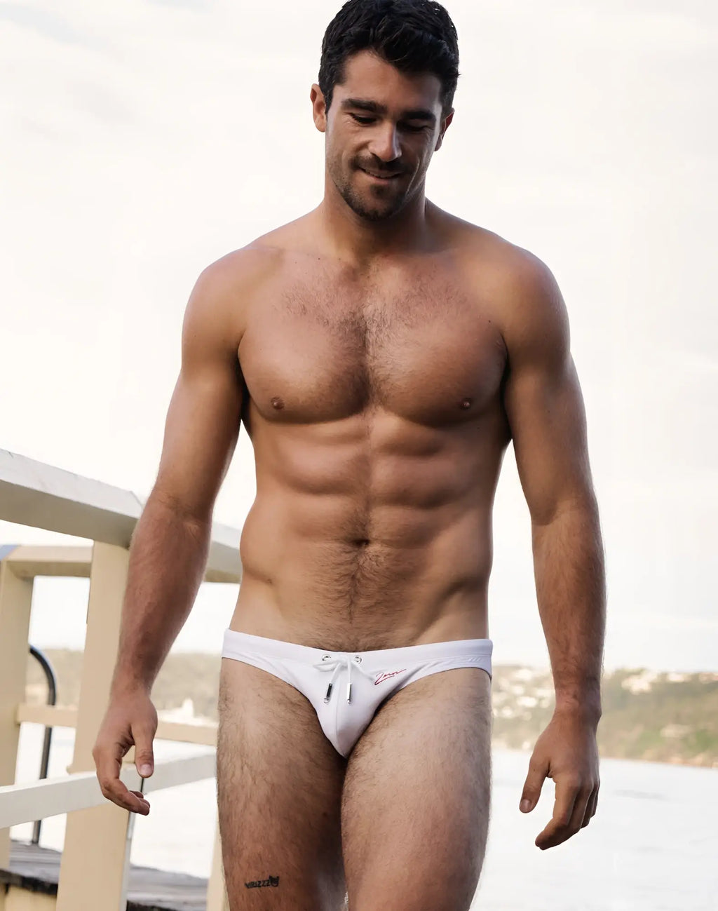 White 2eros v20 signature swim brief with small red logo on front perfect for beach and pool use