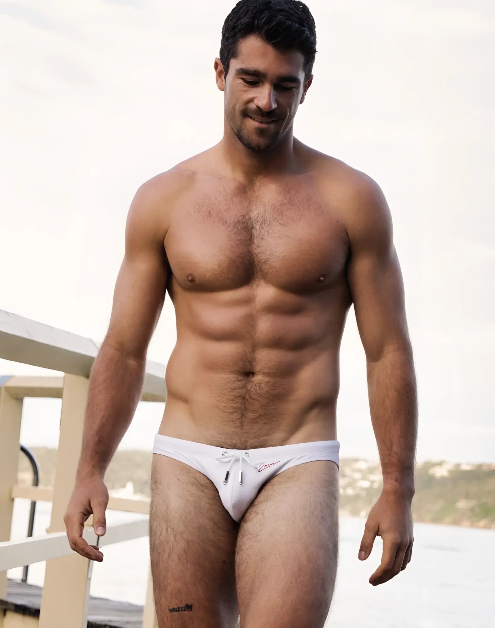White 2eros v20 signature swim brief with small red logo on front perfect for beach and pool use