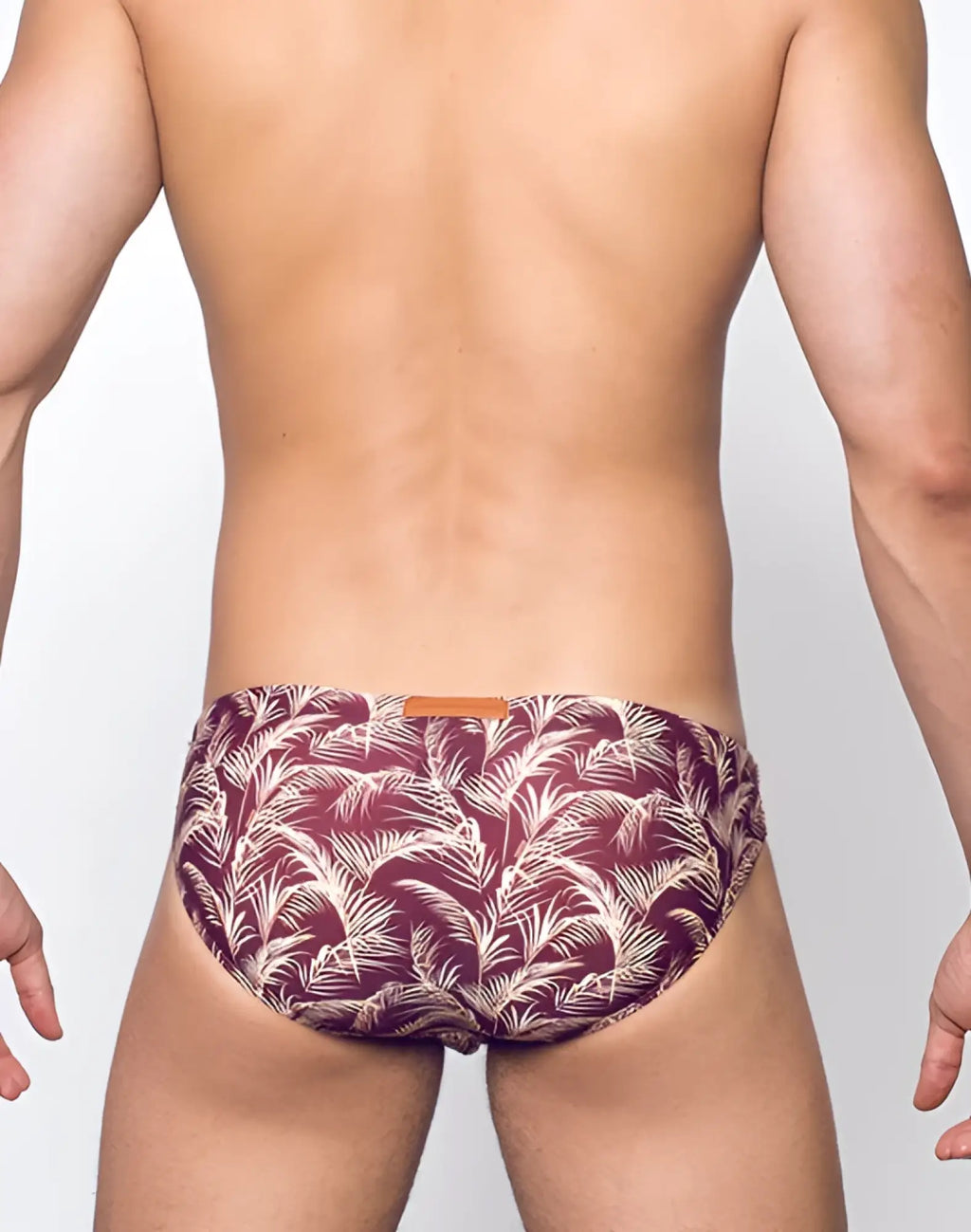 Maroon and white tropical leaf patterned men’s swim briefs by 2eros v20 signature in hawaiian night design
