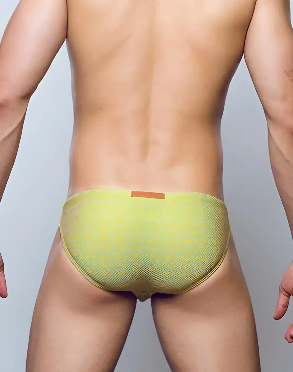 2eros v20 signature swimwear linn lime green patterned swim trunks with subtle geometric design and orange waistband tag
