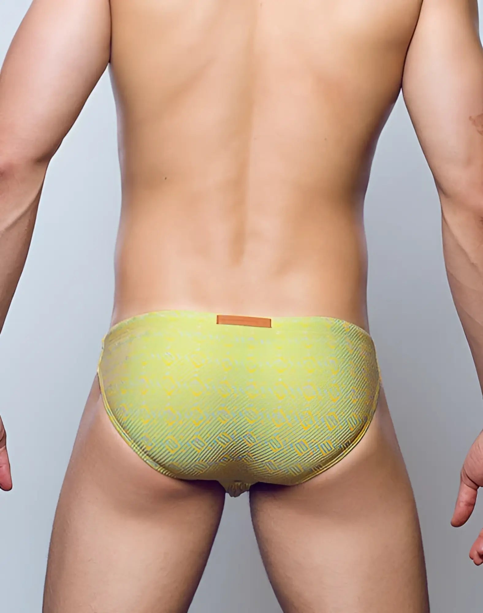 2eros v20 signature swimwear linn lime green patterned swim trunks with subtle geometric design and orange waistband tag