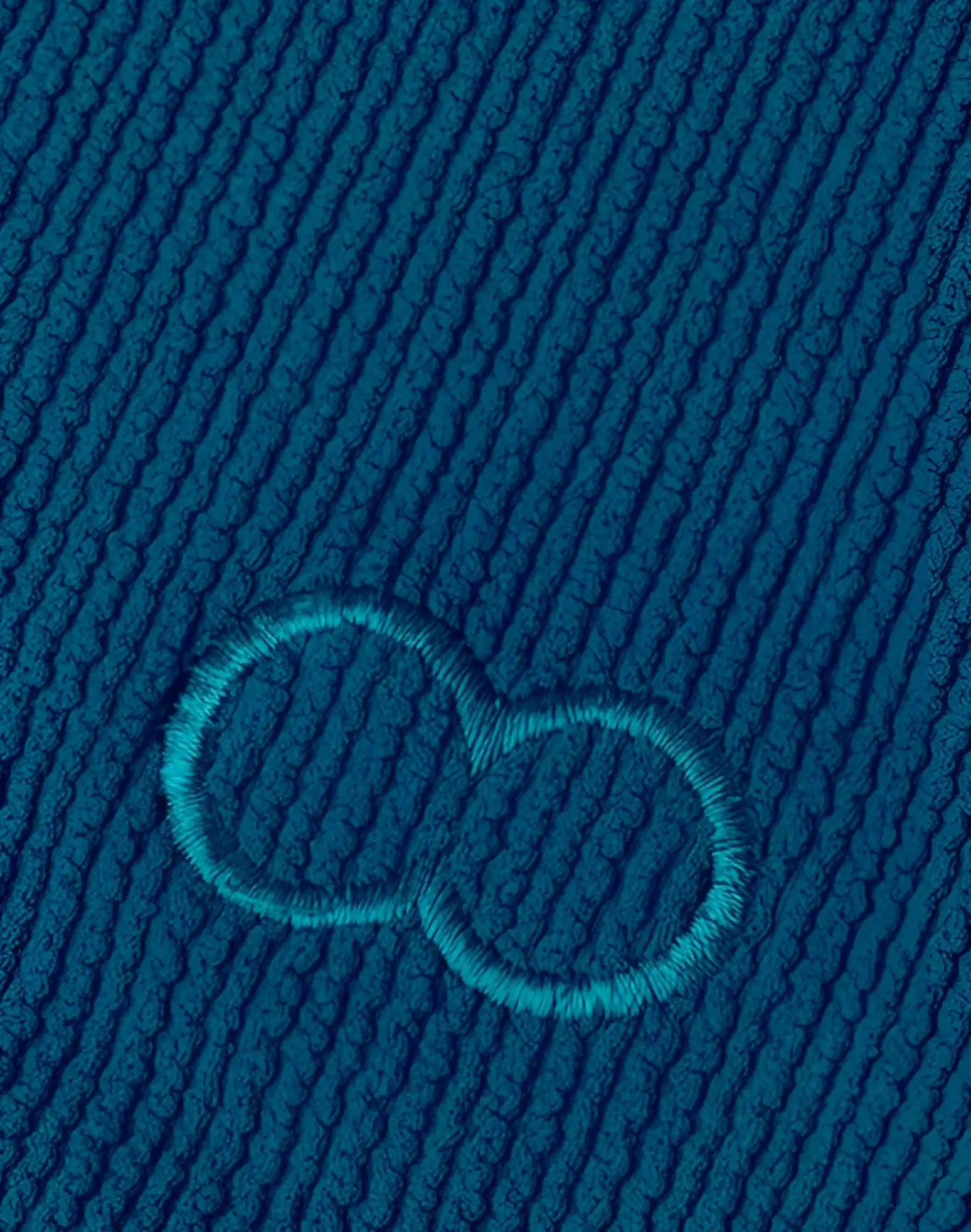 2EROS V20 swim brief in railroad teal deep teal ribbed fabric with subtle embroidered infinity symbol detail