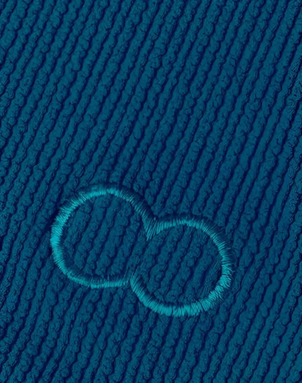2EROS V20 swim brief in railroad teal deep teal ribbed fabric with subtle embroidered infinity symbol detail