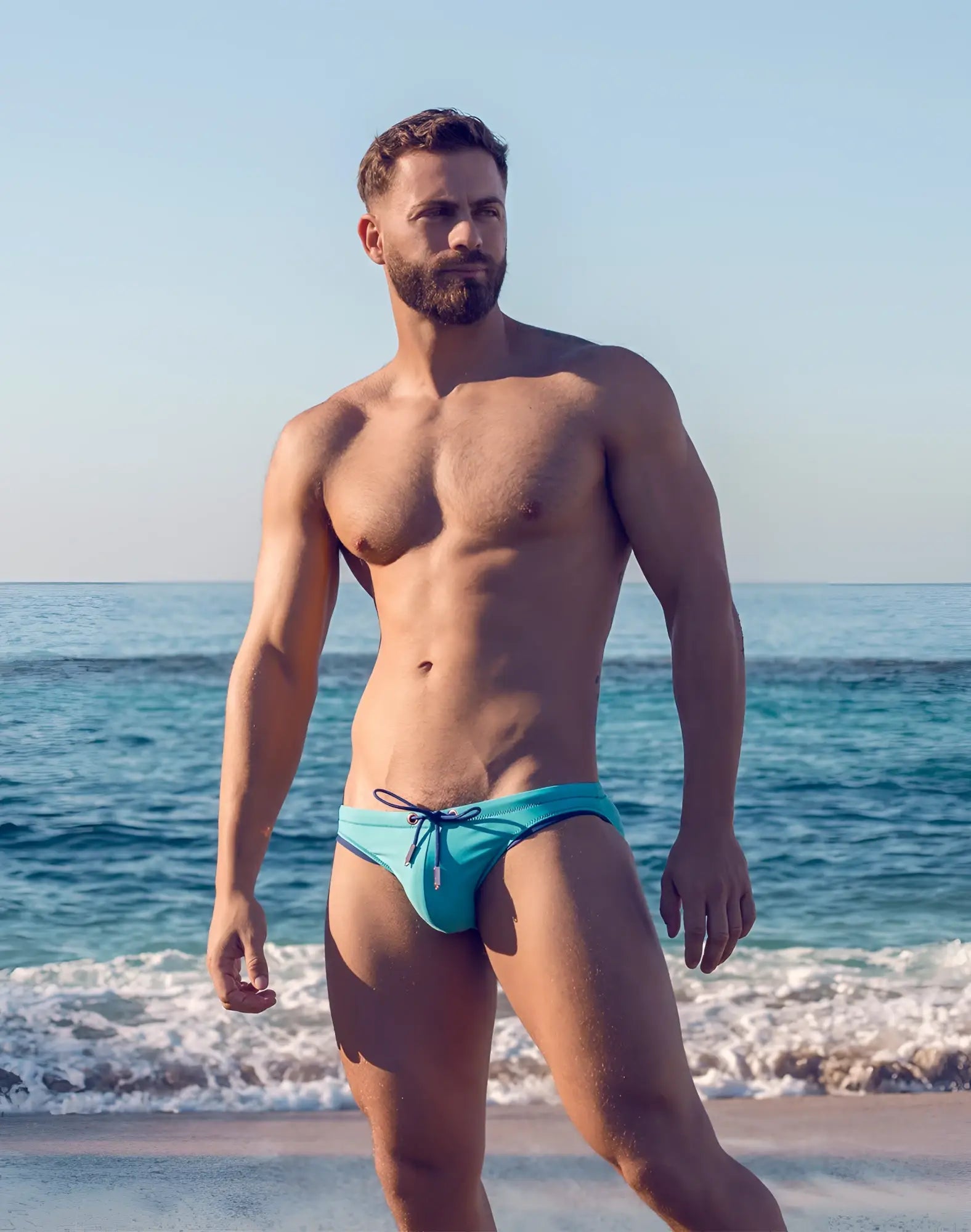 2EROS V22 Rapid swim brief in vibrant turquoise with navy blue trim and matching drawstring for aquatic use