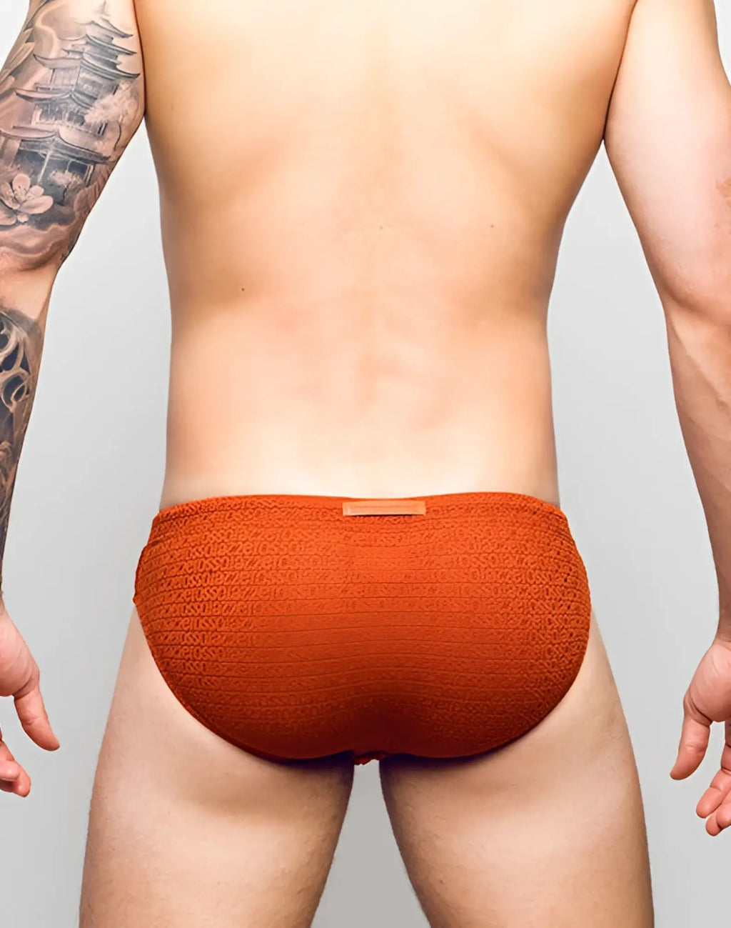 2EROS V30 textured swim brief in signet carmine orange with sozio pattern and small waistband label for swimwear use