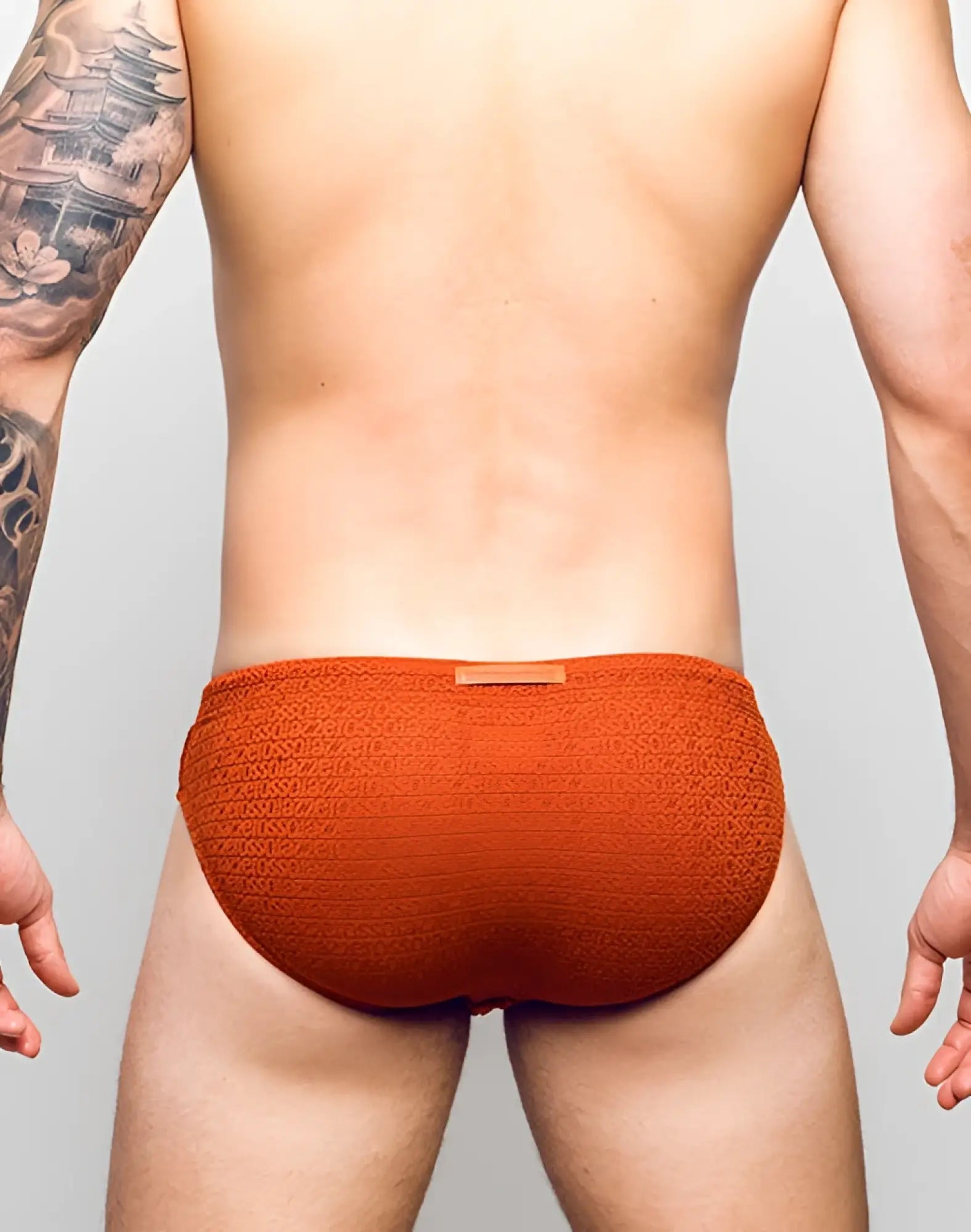 2EROS V30 textured swim brief in signet carmine orange with sozio pattern and small waistband label for swimwear use