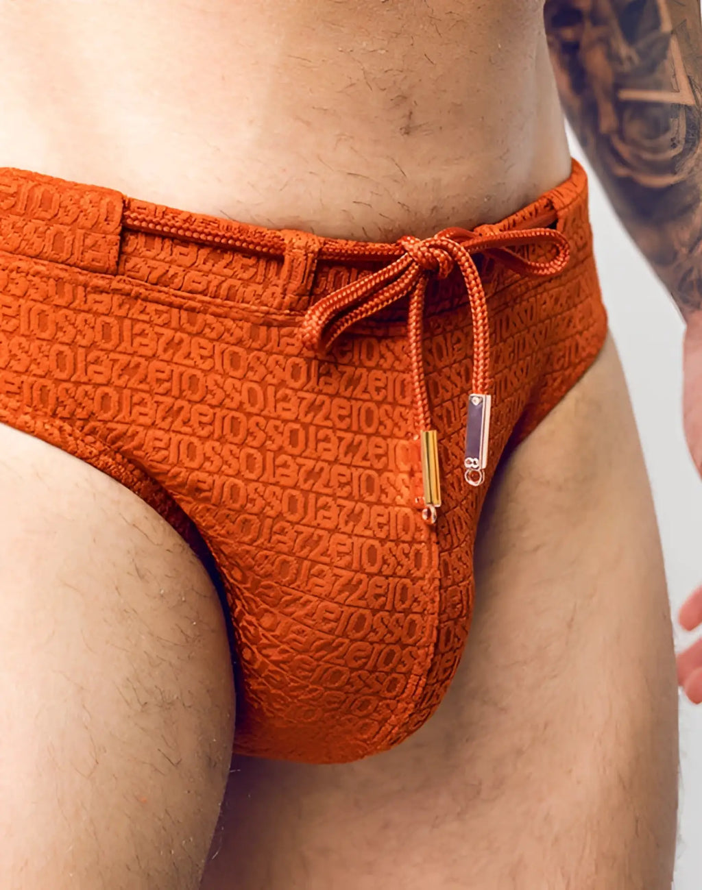 2EROS V30 textured orange swim brief with gios pattern and matching drawstring tie for stylish swimwear