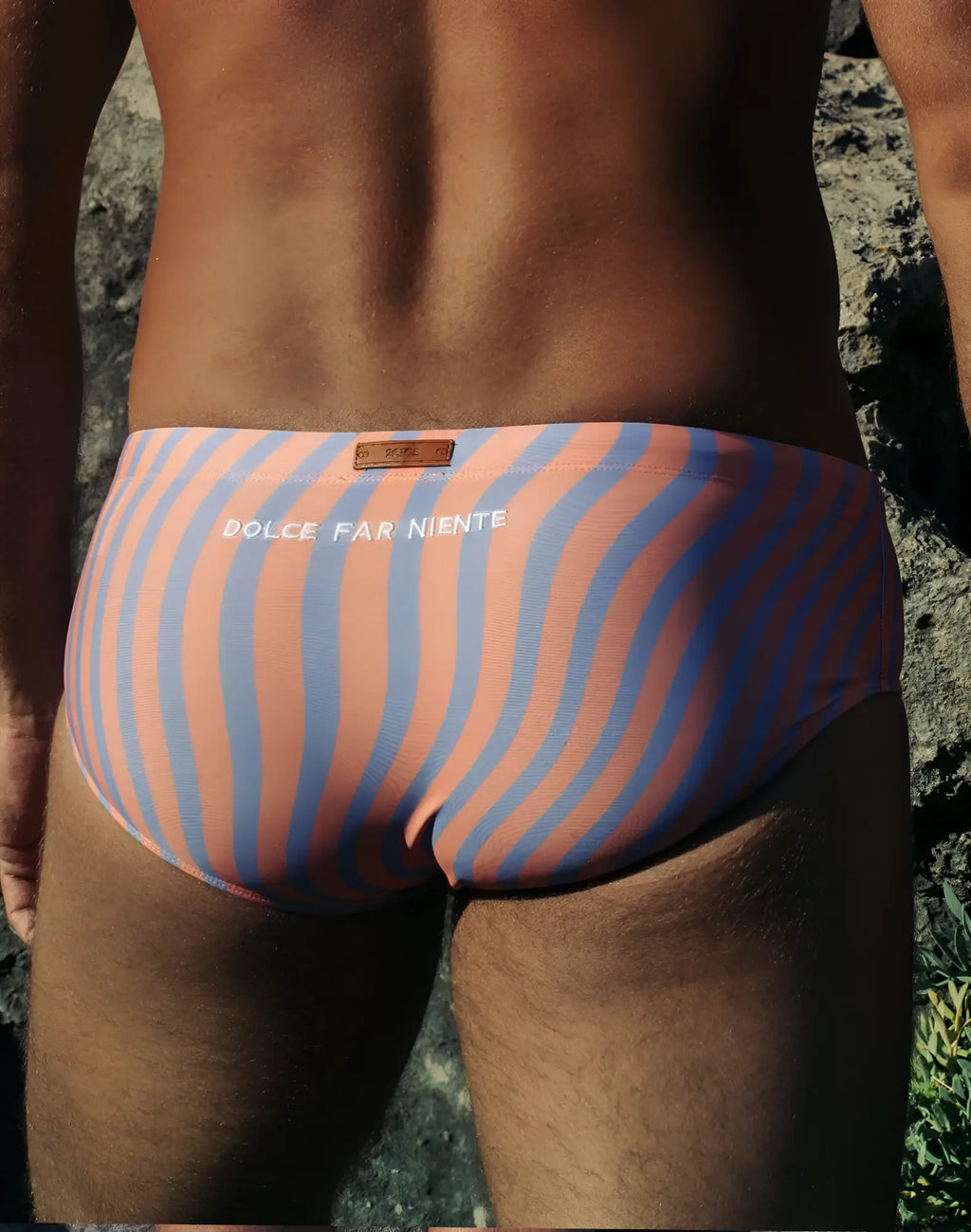 A pair of 2EROS V40 printed swim sunga in coral and blue with bold wavy stripes and dolce far niente waistband
