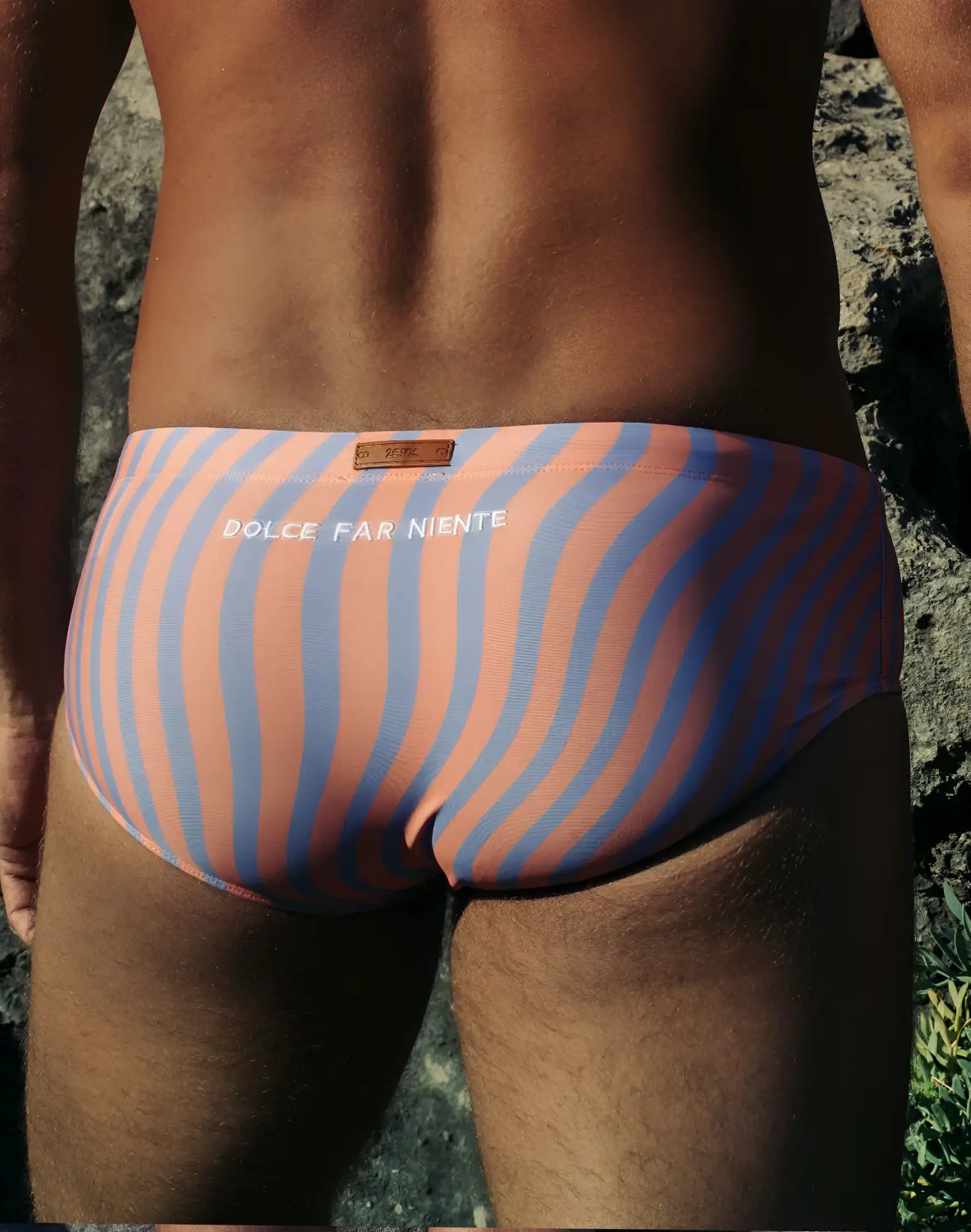 A pair of 2EROS V40 printed swim sunga in coral and blue with bold wavy stripes and dolce far niente waistband