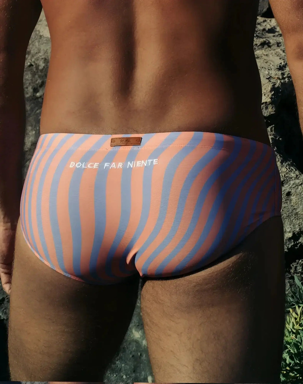A pair of 2EROS V40 printed swim sunga in coral and blue with bold wavy stripes and dolce far niente waistband