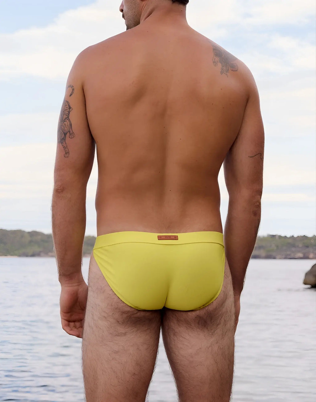 Bright yellow 2eros v50 encore swim tanga with a small brown label at the waistband for vibrant beachwear