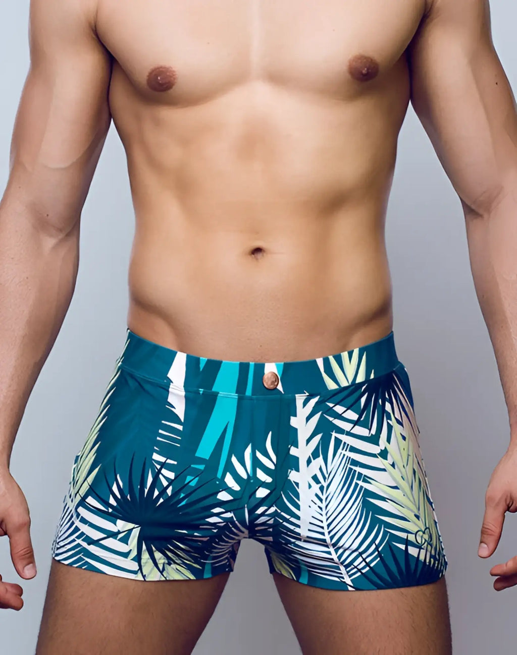 2eros v60 bondi print swim trunks in teal and white tropical leaf pattern with gold toned button closure