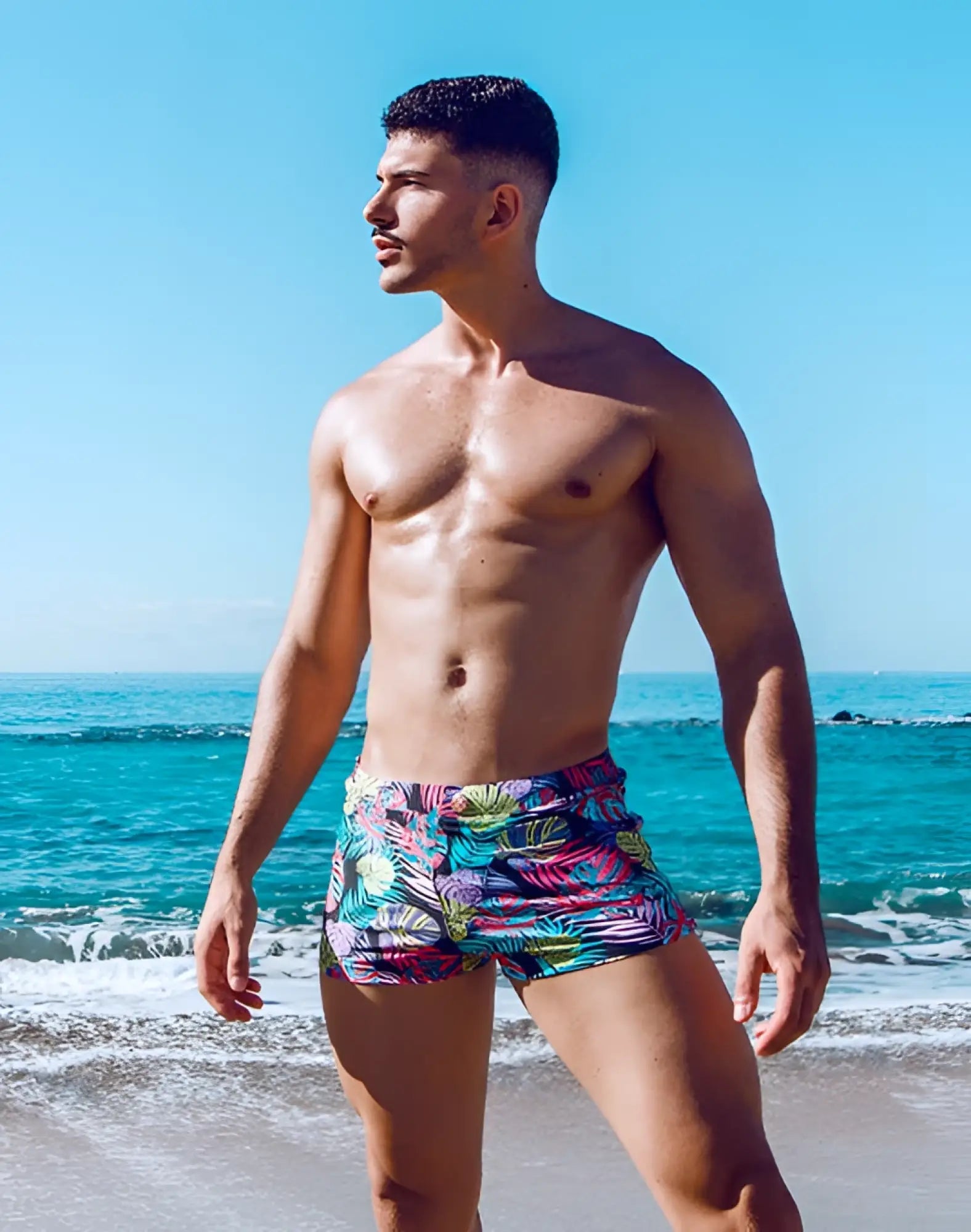 2eros v60 bondi print swim trunks featuring vibrant monstera print in bold pink teal and green tropical hues