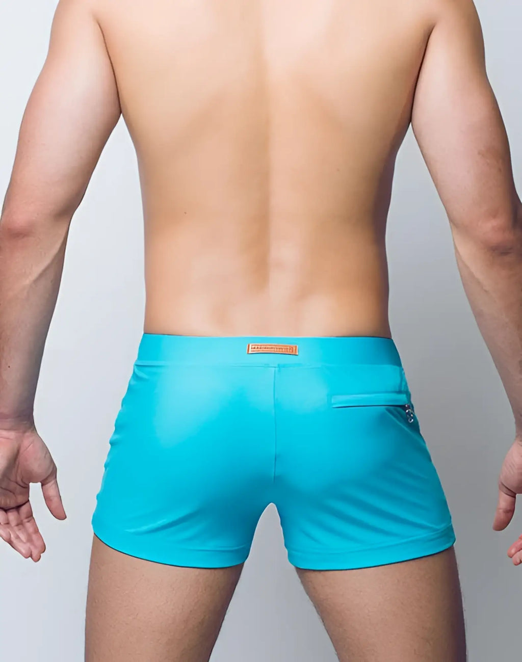 Turquoise 2EROS V60 Bondi swim trunks with sleek form-fitting design and small orange brand tag at waistband