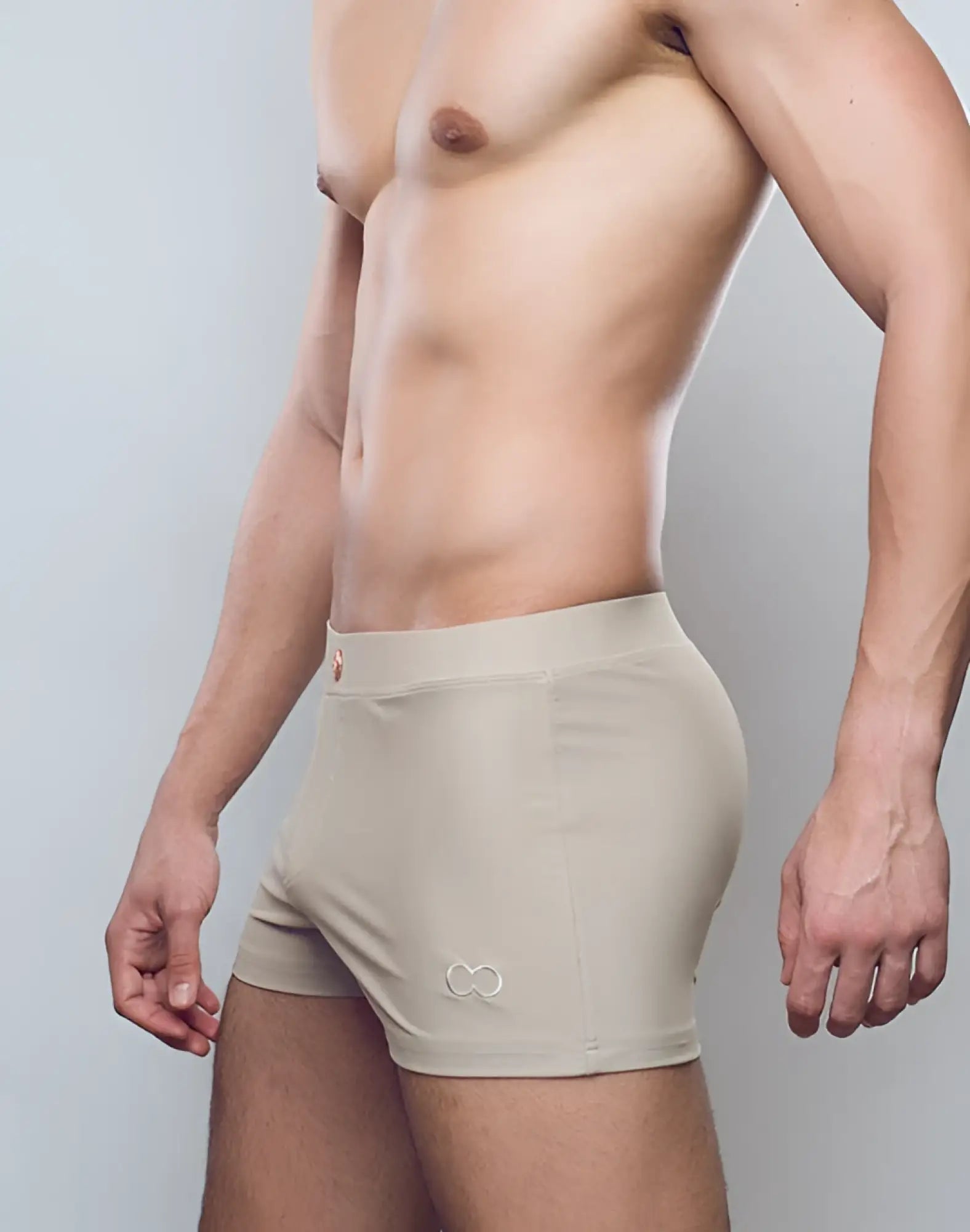 Beige 2eros v60 bondi series 1 swim trunks with subtle embroidered logo on lower left leg for aquatic use