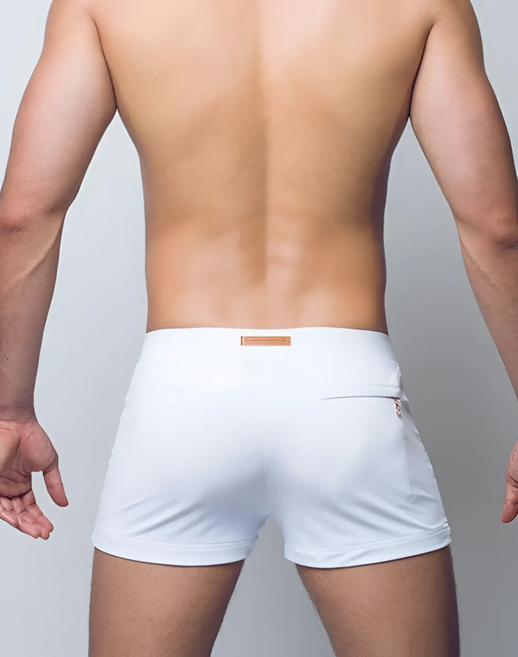 White 2eros v60 bondi swim trunks with subtle orange logo on waistband and zippered side pocket