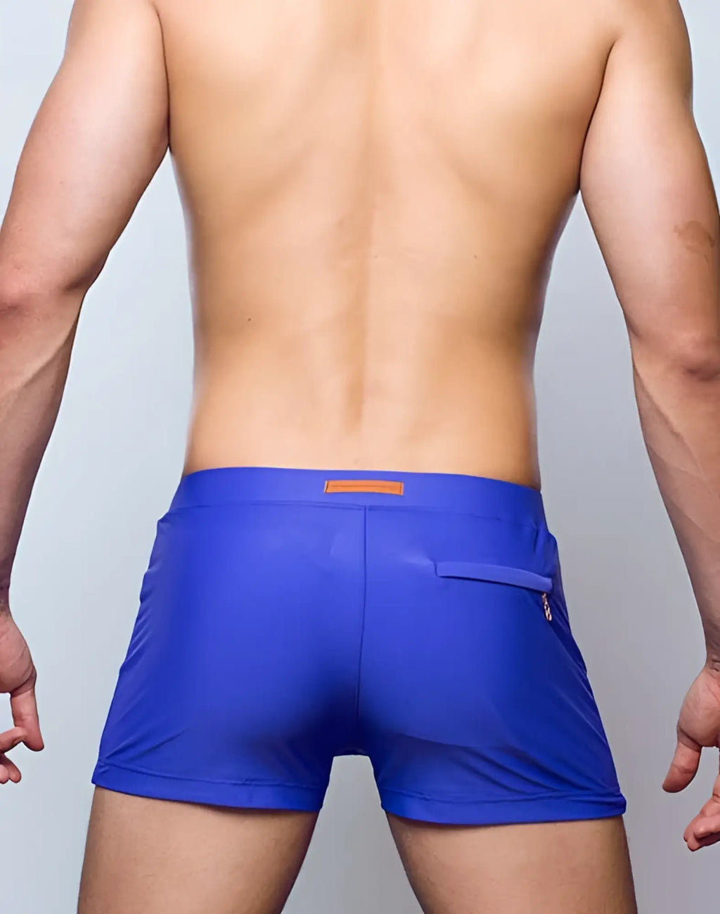 Blue 2EROS V60 Bondi series 2 swim trunks with orange waistband logo and zippered pocket in dusted purple color