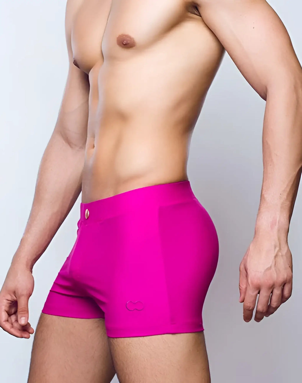 Bright fuchsia 2EROS V60 Bondi swim trunks featuring a subtle logo on the lower left leg for beachwear use