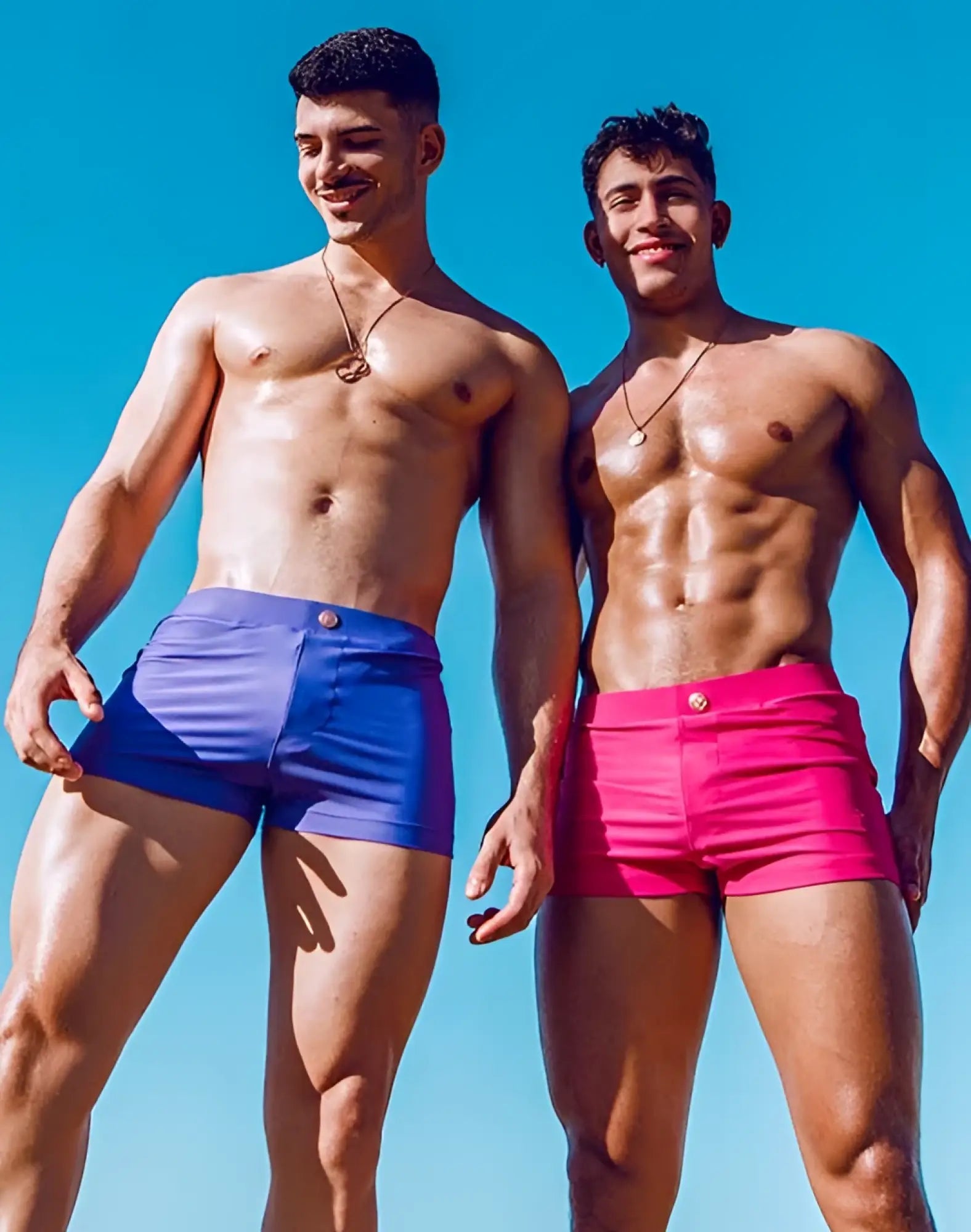 Vibrant blue and pink 2EROS V60 Bondi series 2 swim trunks with sleek glossy finish in fuchsia red color