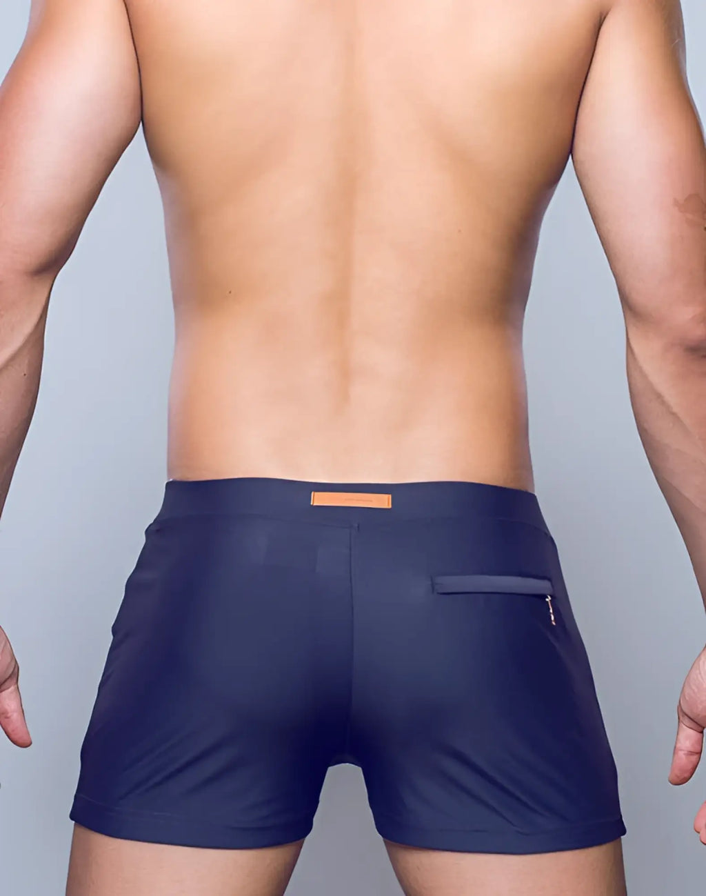 Navy blue 2eros v60 bondi series 2 swim trunks with tan leather patch and zippered pocket on back right side