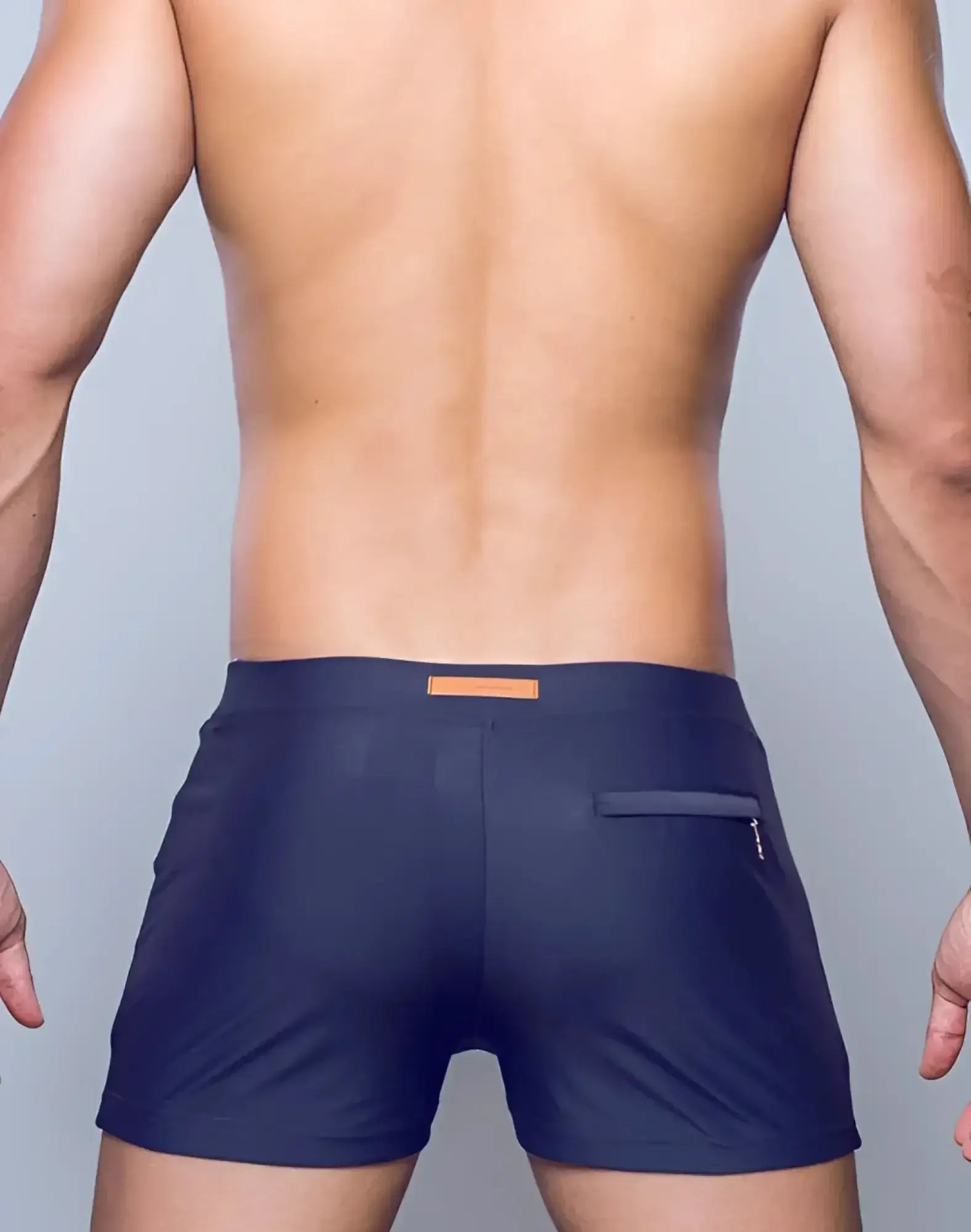 Navy blue 2eros v60 bondi series 2 swim trunks with tan leather patch and zippered pocket on back right side