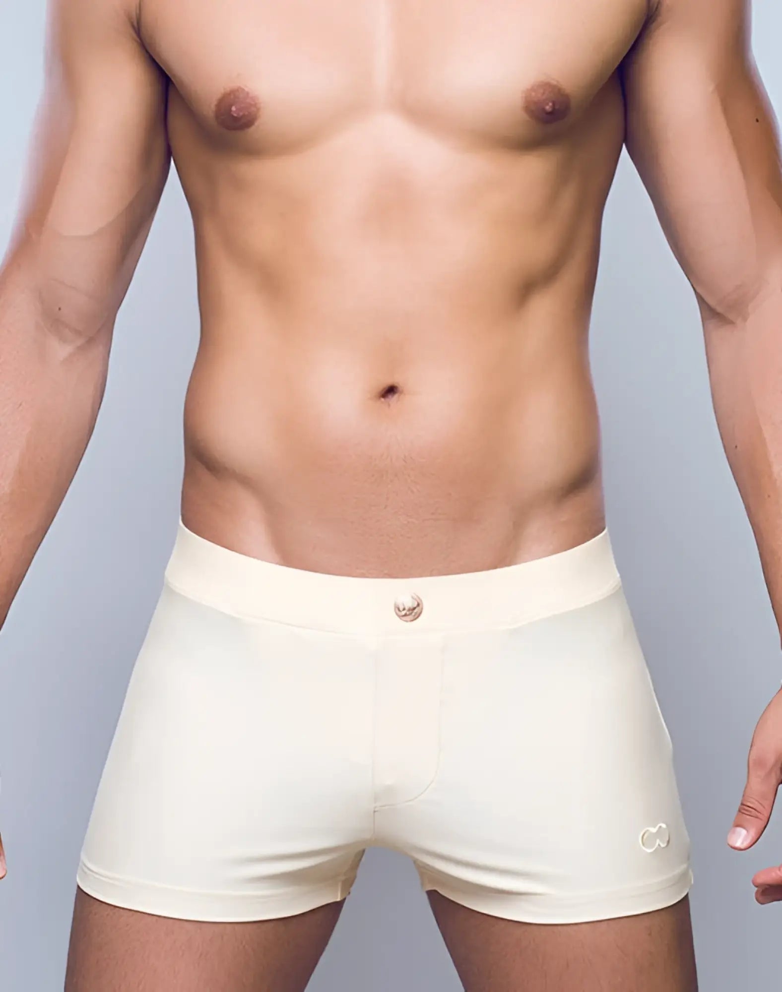 Cream-colored form-fitting boxer briefs with subtle logo waistband and metallic button closure in 2EROS V60 Bondi sand