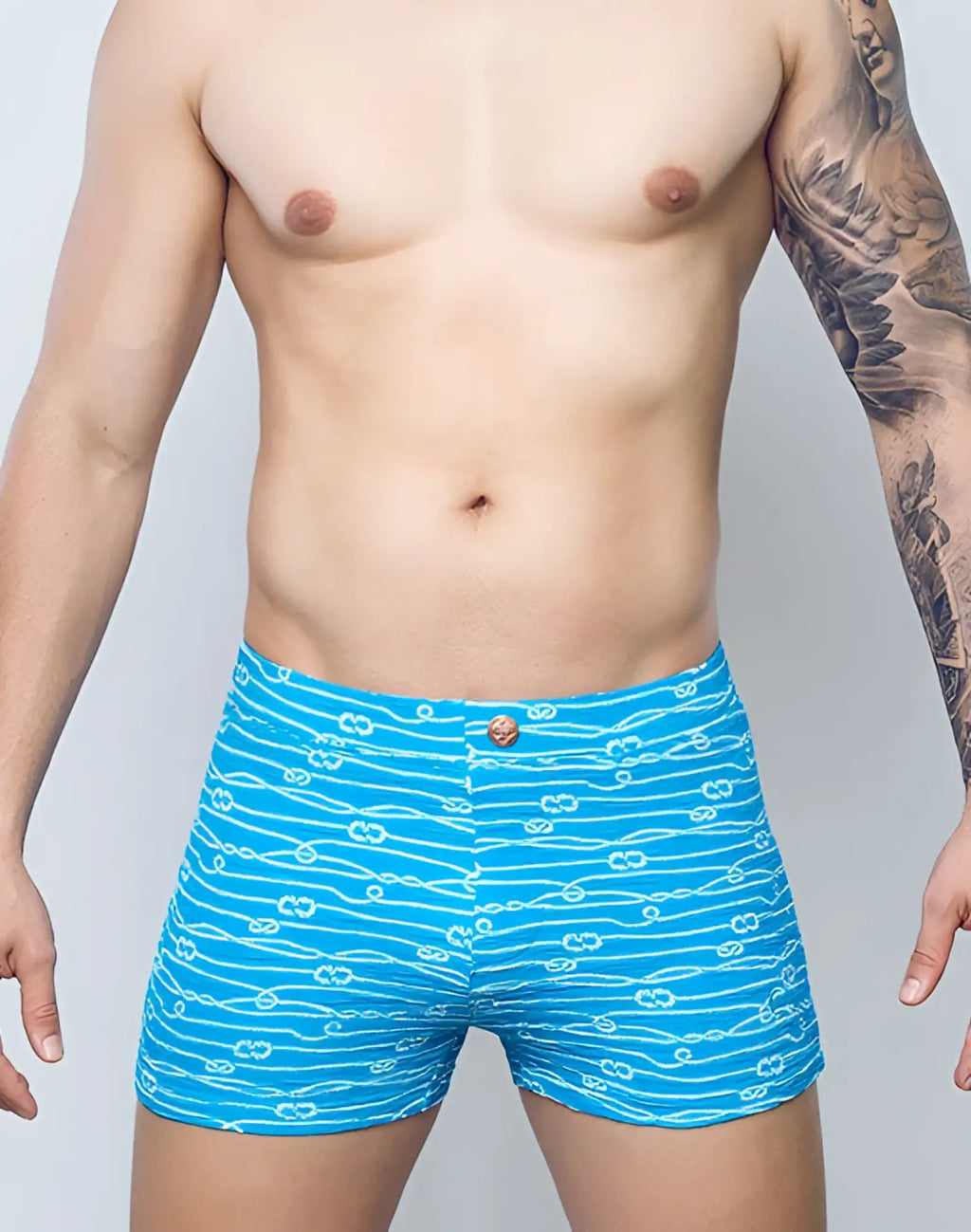Bright blue 2eros v60 print swim trunks with white rope knot pattern and matching button closure for men